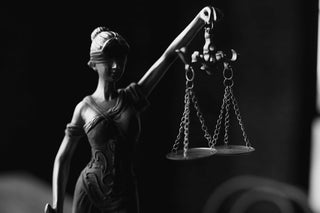 statue holding scales - reflecting balanced investment portfolio