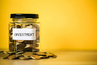 jar of coins for investing a lump sum of money
