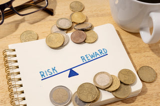 paper displaying Risk vs Reward When Investing