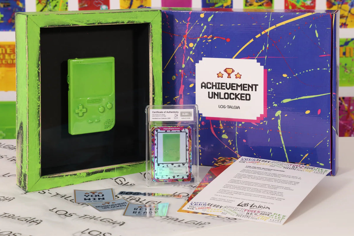 HI-003 photographed from the front: the framed piece with its certificate card, presentation box, stickers and authentication sheet.