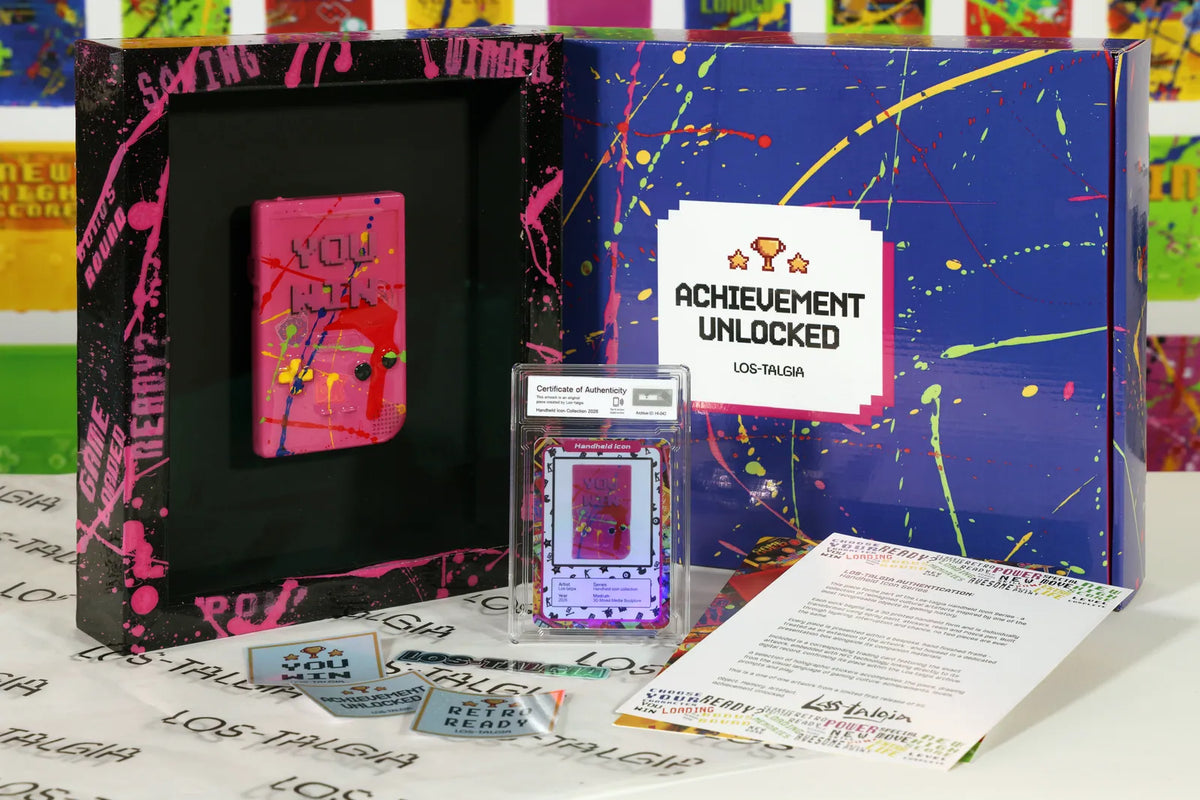 HI-042 photographed from the front: the framed piece with its certificate card, presentation box, stickers and authentication sheet.