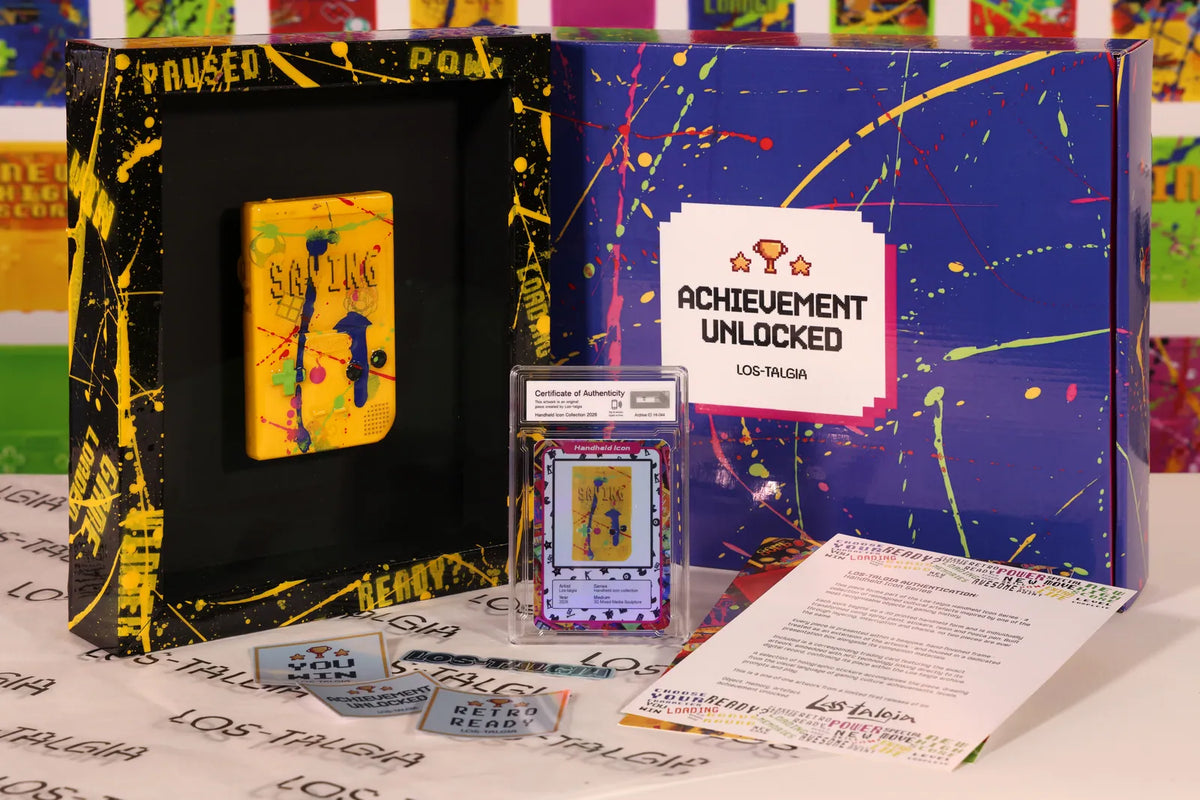HI-044 photographed from the front: the framed piece with its certificate card, presentation box, stickers and authentication sheet.